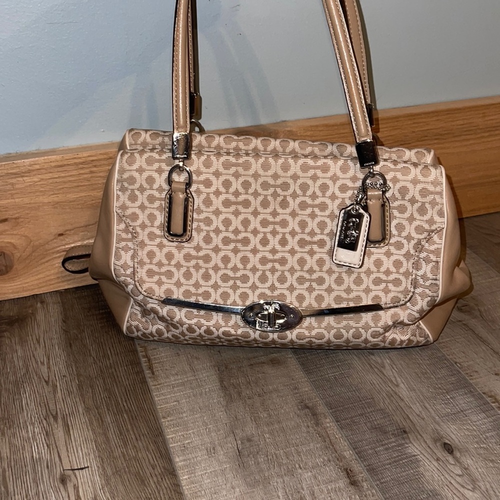 Coach tan and white handbag. Sizing: 12”W x 8”H x 5.5” D.